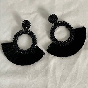 Black, shiny earrings with fringe